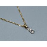 Ladies 9ct gold 3 stone diamond pendant and chain featuring 3 round brilliant cut