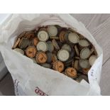 Bag containing a large Quantity of Guinness bottle tops