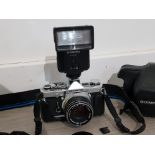 Olympus OM-1 camera with case and flash