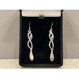 Silver twisted long drop earrings