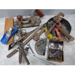 Box containing a variety of vintage hand tools