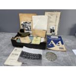 Box of ephemera containing military note books photos etc