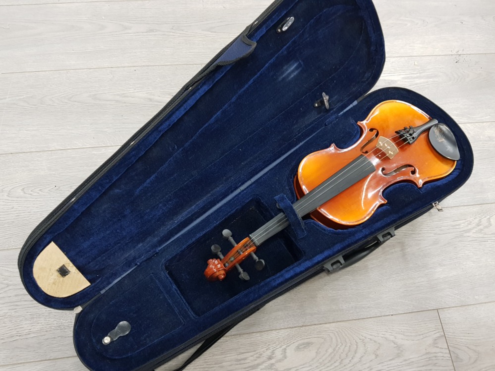 A good quality well loved violin in carry case