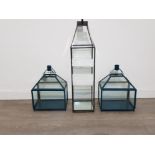 Three modern garden lanterns.tall one slightly damaged but all unused.