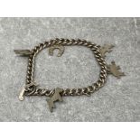 Silver curb bracelet with 5 charms 13.79g