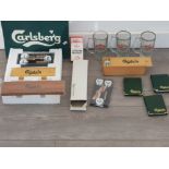 A collectabe games lot. all carlsberg to include darts,playing cards ,dominoes and three notepads