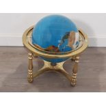 Gemstone globe on brass effect stand, revolving and complete with compass