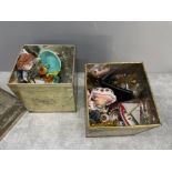 2 tins on miscellaneous items including glass, porcelain and brass