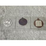 Bronze, silver on bronze and hallmarked silver life charm pendants issued by the circle of Raphael