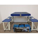 A four person family dome tent along with a folding up table in case