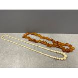 2 vintage necklaces, 1 honey coloured amber approx 44cms and another bone/ivory approx 58cms both in