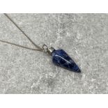 Blue stone pendant on silver chain