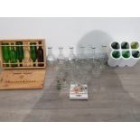 A lot of glassware including carafes wine bottles and six mouton cadet wine bottles along with case