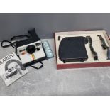 Vintage Polaroid 1000 land camera and the bell home cine de luxe model projector both boxed in