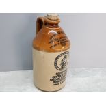 Large vintage stoneware advertising flagon 1956 with original stopper, 28cm