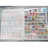 Album of stamps from around the world, 26 pages full of unc stamps, inc south african