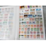 Album of stamps from around the world containing hundreds well presented uncirculated countries such