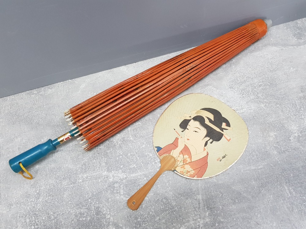 1930s Chinese parasol made from waxed paper and hand painted together with a hand face fan,