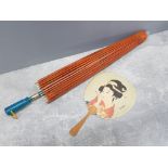 1930s Chinese parasol made from waxed paper and hand painted together with a hand face fan,