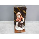 Boxed G.Armani Napoli figurine of boy sitting on a football