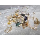 Bag of mixed costume jewellery mainly necklaces some with pendants