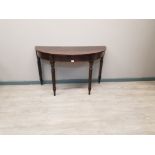 Demi lune mahogany hall table with tapered legs.