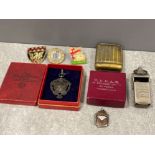 Hallmarked silver shield, whistle, vesta case and badges