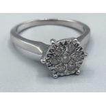 Ladies 9ct white gold diamond cluster ring featuring 7 round brilliant cut diamonds 2.88g size L1/2