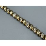 Ladies gold and diamond bracelet featuring plain and diamond set links. Each link has 2 round