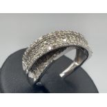 Ladies 9ct white gold diamond cluster crossover ring comprising of 132 round brilliant cut