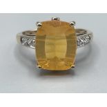 Ladies 9ct gold yellow stone and diamond ring. 3.31g size O