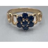 9ct gold 7 stone sapphire flower ring. 2.36g size N1/2