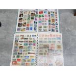 2 stamp albums presenting a large amout of uncirculated stamps from around the world