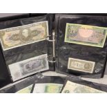 Black album containing Banknotes from Brazil, Japan and Indonesia