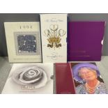 Commemorative crowns in folders including HRH Prince of Wales, Queen mother, Diana memorial
