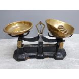 Set of cast iron kitchen scales to weigh 11lbs with brass pans and weights