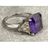 Ladies 9ct white gold purple and white stone ring. Large centre stone and CZ on the shoulders 7.2g