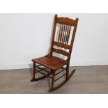Antique hand carved mahogany rocking chair, carvings in the style of Northwind face and with 2
