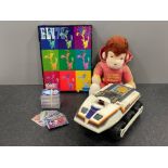 Toys including Curious George the jogger, bigtrak, Elvis jigsaw puzzle and Match Attax football