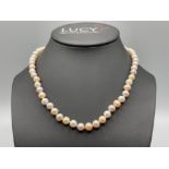 Ladies string of cultured pearls with flower design catch