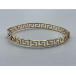 9ct gold fancy Greek key patterned Bangle. Very good condition 8.5G