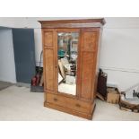 Edwardian double wardrobe in oak, with internal hanging rail, fitted with large single drawer to the