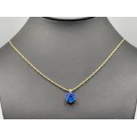 Ladies 9ct gold blue stone pendant and chain