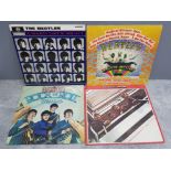 4 lp records by the beatles includes A hard days night, magical mystery tour, rock n roll music