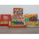 Seven vintage board games all boxed to include two tidley winks,solitaire snakes and ladders etc