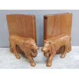 Pair of heavy exotic wood bookends featuring lions and books