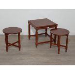 A nice mahogany nest of tables to include two folding circular dropleaf tables with brass handles