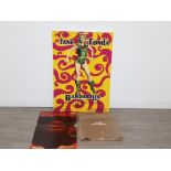 A canvas print advertising Jane Fonda as barbarella along with two pin up calendars the pirelli