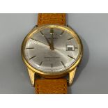 Gents Seiko watch. Gold plated with brown leather strap, date displayed at 3 and automatic movement