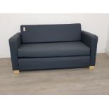 Upholstered modern two seater bed settee.